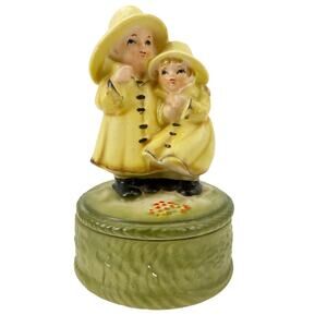vintage Children in Rain Coats ceramic Music Box yellow green Japan needs repair